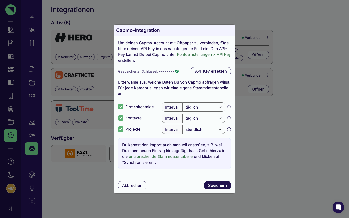 Verbindungs-Modal der Capmo-Integration mit der maskierten Zeile Gespeicherter Schlüssel, dem Button API-Key ersetzen und den Sync-Kategorien Firmenkontakte, Kontakte und Projekte samt Intervallen