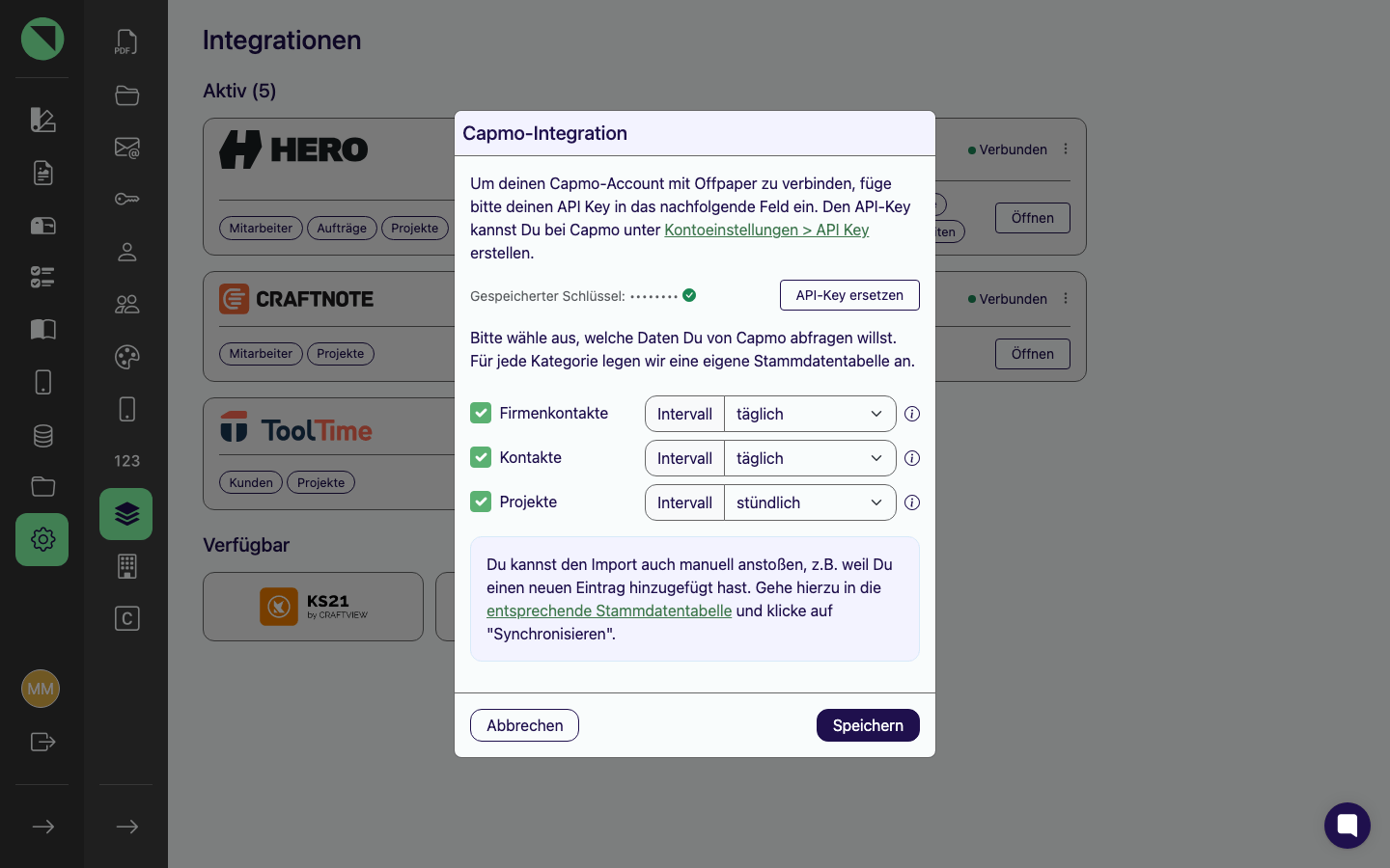 Verbindungs-Modal der Capmo-Integration mit der maskierten Zeile Gespeicherter Schlüssel, dem Button API-Key ersetzen und den Sync-Kategorien Firmenkontakte, Kontakte und Projekte samt Intervallen